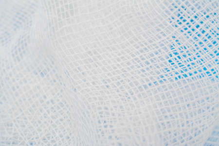 medical bandage texture on a blue backgroundの写真素材
