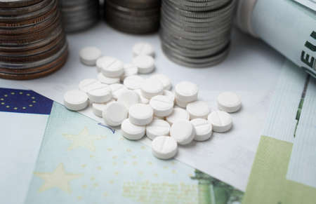 Pharmaceutical business abstract, white pills on a blue backgroundの写真素材