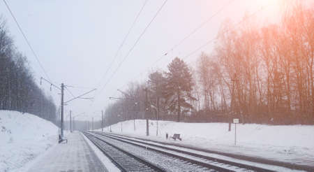 Train tracks in winter mist, snow close upの写真素材