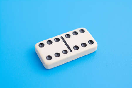 Playing dominoes on a blue background sign abstractの写真素材