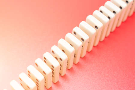 Dominoes on red table isolated, symbol abstractの写真素材