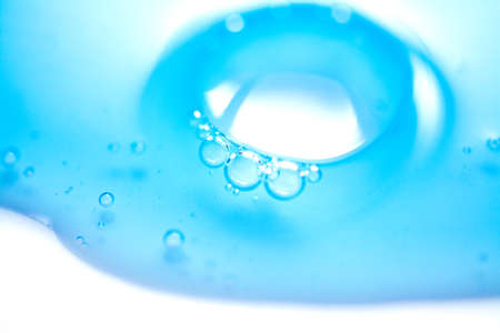 Blue gel liquid background close-up or texture