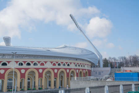 MINSK, BELARUS - MARCH, 19, 2019: Old part of Dynamo stadium, Important football facility of the city of Minsk and Belarus over blue sky.のeditorial素材