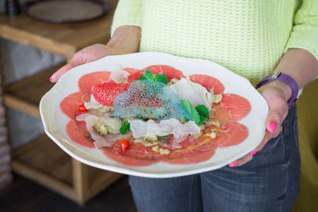 salad with red tuna artichokes and mint leavesの写真素材