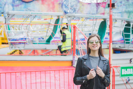 Portrait of an attractive girl in an amusement parkの写真素材