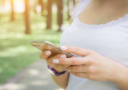 female chatting in network on cell telephoneの写真素材