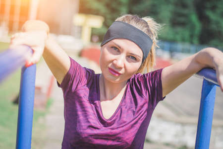 Portrait of a beautiful girl athlete who plays sports in natureの写真素材