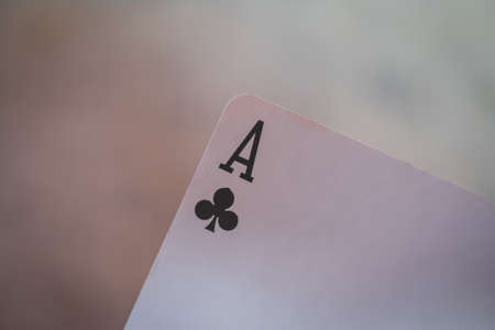 Playing cards in hand on the table, poker nands, game conceptの写真素材