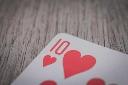 Playing cards in hand on the table, poker nands, game conceptの写真素材