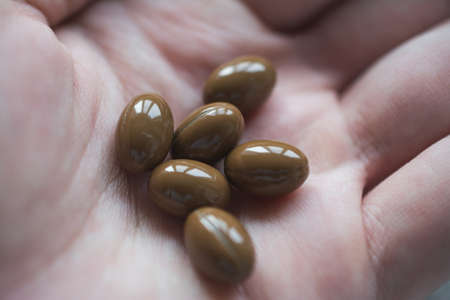 High temperature pills in hand close up