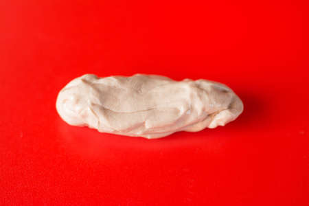 chewing gum on a red background top view