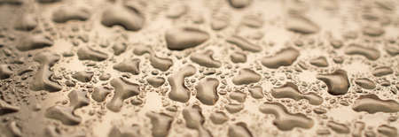 water drops background and texture sepia toned close upの写真素材
