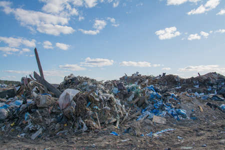 Environmental problems city waste landscape over blue skyの写真素材