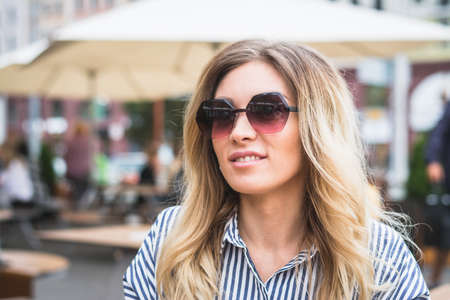 Fashion outdoor portrait of summer hipster woman wearing sunglassの写真素材