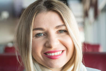 Beautiful business woman blond portrait indoors photo