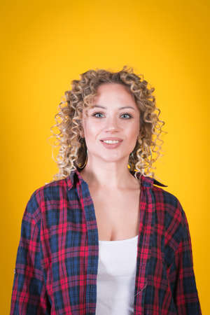 Positive attractive young female with Afro hairstyle, studio shot