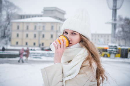 Beautiful stylish girl city portrait in winterの写真素材