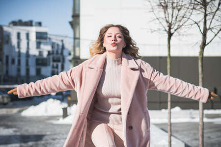 Beautiful stylish russian girl model in winter in the cityの写真素材