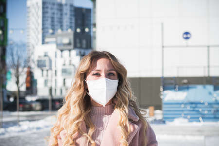 Beautiful stylish russian girl model in winter in the city