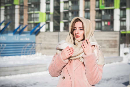 Beautiful and stylish Russian girl model in winter on the street of Moscow