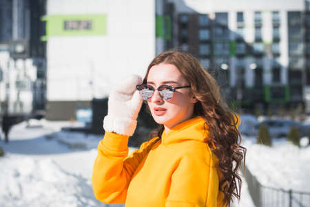 Beautiful and stylish Russian girl model in winter on the street of Moscowの写真素材