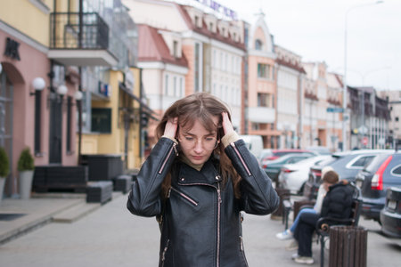 Summer sunny lifestyle fashion portrait of young stylish hipster woman walkingの写真素材
