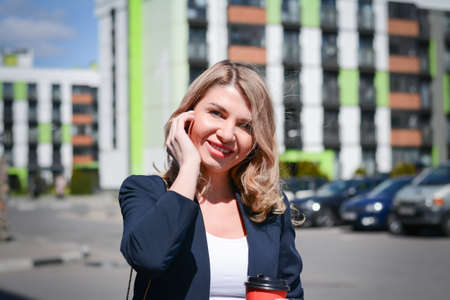 Business woman with a cup of coffee in the business center