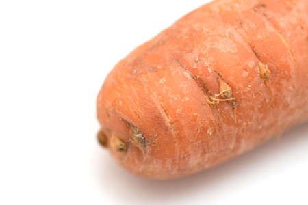 Dirty carrot isolated on white background closeの写真素材