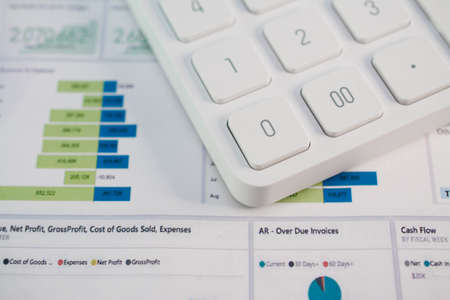 Business concept with accounting white calculator and financial dataの写真素材