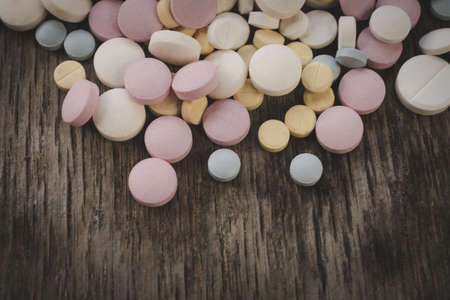 Scattered Headache Pills close to the tableの写真素材