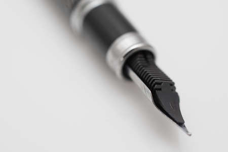 Black ink fountain pen insulated on white backgroundの写真素材
