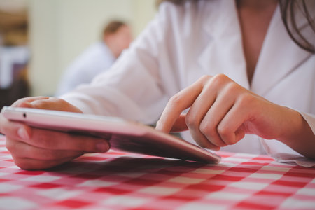 woman using a tablet pc outdoors. high quality photo