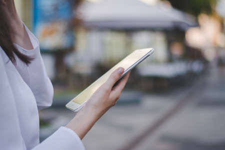 woman using a tablet pc outdoors. high quality photoの写真素材