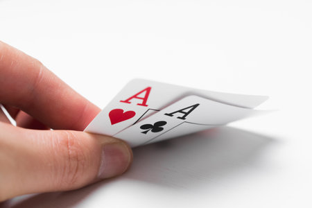 Playing cards two aces of hearts and spades on white background