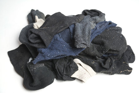 Dirty socks pile isolated on white backgroundの写真素材