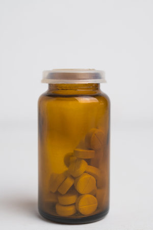 A small glass bottle of pills closeの写真素材