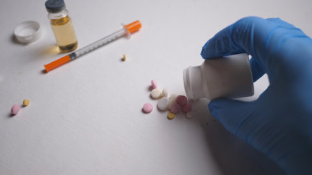 addicts table pills and injection on the black tableの写真素材