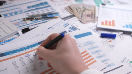 Manager checking the company's annual financial reportの写真素材