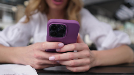 Woman hands using smartphone outside close upの写真素材