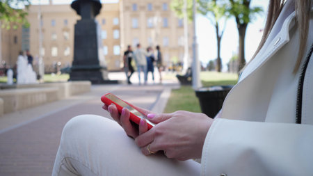 Woman hands using smartphone outside close upの写真素材