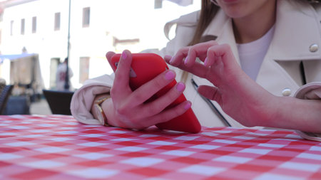 Woman hands using smartphone outside close upの写真素材