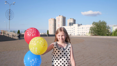 Beautiful little girl portert in the summer in the children's parkの写真素材