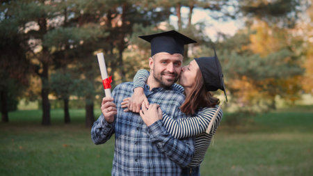 A Graduation Celebration Featuring a Joyful Couple Happily Embraced in Natures Beauty