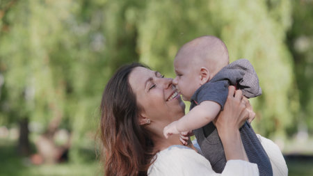 A Joyful and Cherished Moment Shared Between a Loving Mother and Her Baby in Natures Embrace