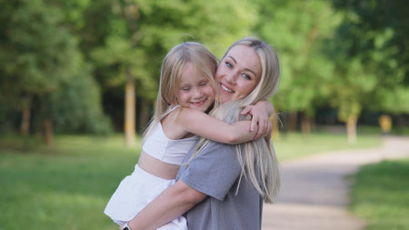 A heartwarming and joyful motherdaughter embrace captured beautifully in natures embraceの写真素材