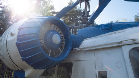 Vintage Helicopter From the Soviet Era on Display in Russia Surrounded by Trees Showcasing Its...