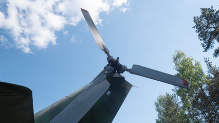 Vintage Soviet Helicopter Rotor Against a Clear Blue Sky, Showcasing Intricate Mechanics and a Sense of Nostalgia for Russian Aviation Historyの写真素材
