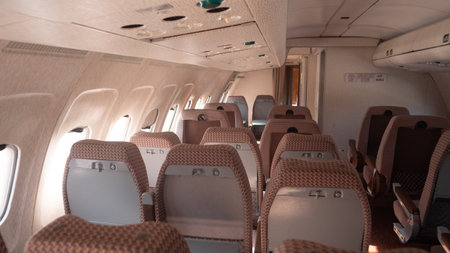 Vintage Interior of a Soviet-era Aircraft Showcasing Empty Passenger Seating and Cabin Design in Russiaの写真素材