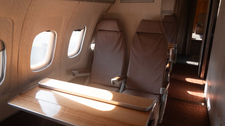 Vintage USSR Airplane Interior Showcasing Seating Arrangement and Wooden Tables From a Bygone Era