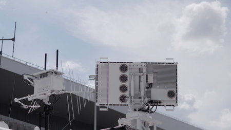 Various radar systems are showcased at a technology exhibition, highlighting innovations in surveillance and detection capabilities under a bright sky.の写真素材